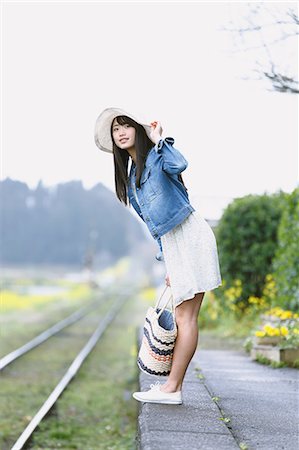 simsearch:859-08704133,k - Attractive young Japanese woman at local train station in the Japanese countryside Stock Photo - Rights-Managed, Code: 859-08704140