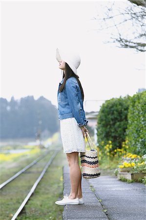 simsearch:859-08704133,k - Attractive young Japanese woman at local train station in the Japanese countryside Stock Photo - Rights-Managed, Code: 859-08704141