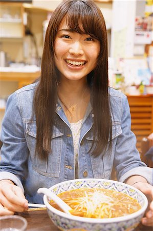simsearch:859-08704133,k - Attractive young Japanese woman eating ramen noodles Stock Photo - Rights-Managed, Code: 859-08704155