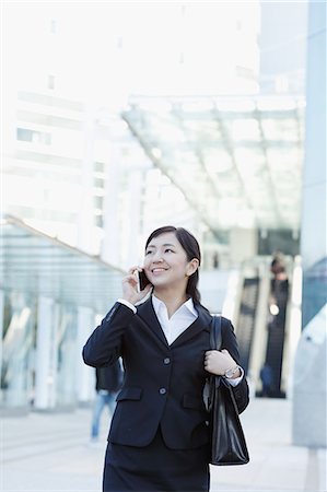 simsearch:859-07356378,k - Japanese young businesswoman on the phone downtown Tokyo Stock Photo - Rights-Managed, Code: 859-08887548