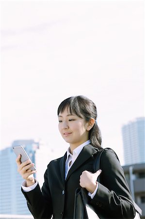 simsearch:859-07356378,k - Japanese young businesswoman with phone downtown Tokyo Stock Photo - Rights-Managed, Code: 859-08887541