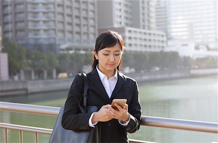simsearch:859-06538080,k - Japanese young businesswoman with phone downtown Tokyo Stock Photo - Rights-Managed, Code: 859-08887652