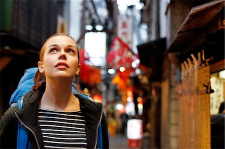 pictures of places to shop in tokyo - Caucasian backpacker downtown Tokyo at night, Tokyo, Japan Stock Photo - Rights-Managed, Code: 859-08993852