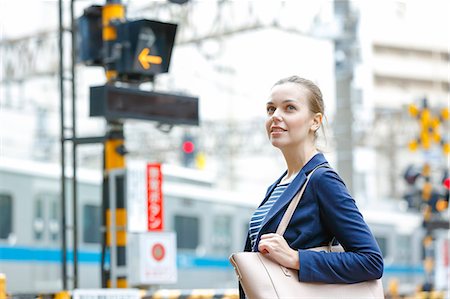 people waiting for train - Caucasian woman downtown Tokyo, Japan Stock Photo - Rights-Managed, Code: 859-08993882