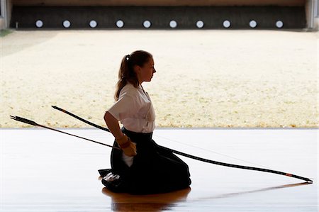 simsearch:859-09018730,k - Caucasian woman practicing traditional Kyudo Japanese archery Stock Photo - Rights-Managed, Code: 859-09018707