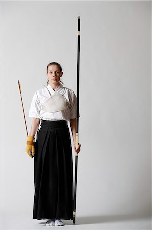 simsearch:859-09018730,k - Caucasian woman practicing traditional Kyudo Japanese archery on white background Stock Photo - Rights-Managed, Code: 859-09018727