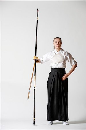 Caucasian woman practicing traditional Kyudo Japanese archery on white background Stock Photo - Rights-Managed, Code: 859-09018737