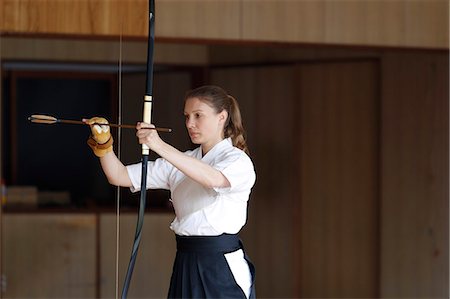 simsearch:859-09018730,k - Caucasian woman practicing traditional Kyudo Japanese archery Stock Photo - Rights-Managed, Code: 859-09018746