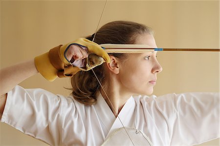 simsearch:859-09018730,k - Caucasian woman practicing traditional Kyudo Japanese archery Stock Photo - Rights-Managed, Code: 859-09018749