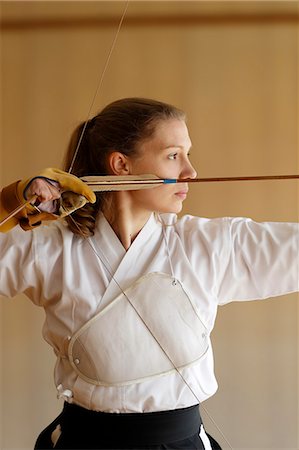 simsearch:859-09018730,k - Caucasian woman practicing traditional Kyudo Japanese archery Stock Photo - Rights-Managed, Code: 859-09018754