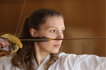 simsearch:859-09018730,k - Caucasian woman practicing traditional Kyudo Japanese archery Stock Photo - Rights-Managed, Code: 859-09018753