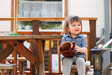 Mixed-race young girl with teddy bear Stock Photo - Rights-Managed, Code: 859-09018790