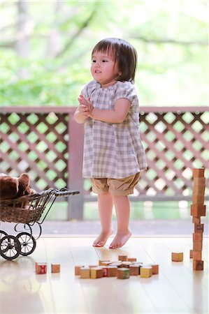 stuffed (people eating too much) - Mixed-race young girl with teddy bear Stock Photo - Rights-Managed, Code: 859-09018806