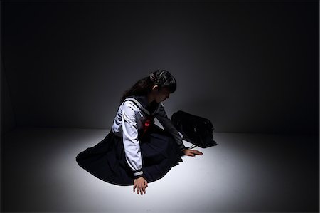 disabled asian people - Japanese schoolgirl sitting in the dark Stock Photo - Rights-Managed, Code: 859-09155279