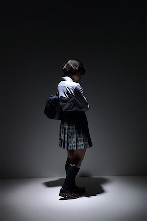 disabled asian people - Japanese schoolgirl standing in the dark Stock Photo - Rights-Managed, Code: 859-09155280