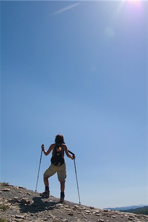 simsearch:400-05025778,k - Person backpacking along with hiking sticks Stock Photo - Rights-Managed, Code: 859-03036391