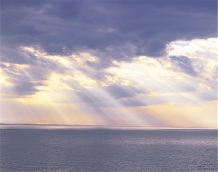 sunrise rays clouds - Heavenly Sunrays Dancing On the Ocean Stock Photo - Rights-Managed, Code: 859-03036501