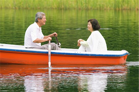 Older Couple In A Boat on a Lake Stock Photo - Rights-Managed, Code: 859-03037419