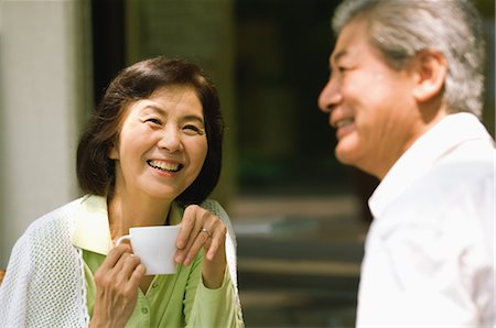 simsearch:859-03037419,k - Older Couple Talking over Cup of Coffee Fotografie stock - Rights-Managed, Codice: 859-03037433