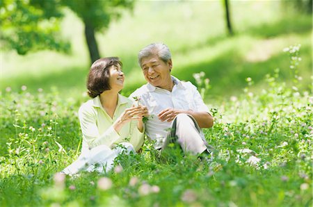 Couple Sitting in Grass Stock Photo - Rights-Managed, Code: 859-03037447