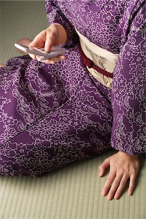Woman in kimono with cell phone Stock Photo - Rights-Managed, Code: 859-03037918