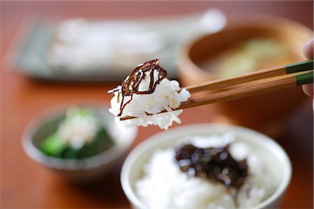 Rice held in chopsticks Stock Photo - Rights-Managed, Code: 859-03037976