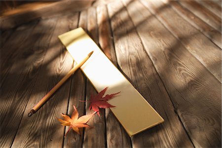 Overhead view of writing board and pencil with maple leaves Stock Photo - Rights-Managed, Code: 859-03038518