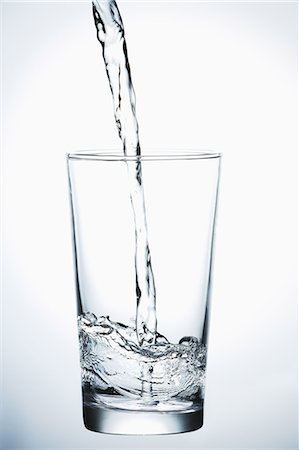 pouring water into glass - Glass of Drinking Water Foto de stock - Con derechos protegidos, Código: 859-03038684