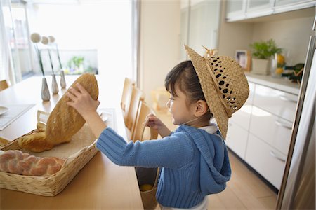 Young Girl Picking Bread Stock Photo - Rights-Managed, Code: 859-03038884