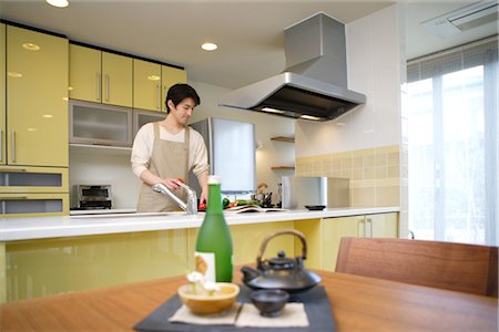 Man Cooking in Kitchen Stock Photo - Rights-Managed, Code: 859-03038915