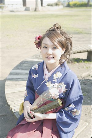 Girl in Kimono Holding Container and Rose Stock Photo - Rights-Managed, Code: 859-03038972