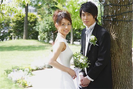 string of pearls for wedding - Bride and Groom Standing by Tree Stock Photo - Rights-Managed, Code: 859-03039079