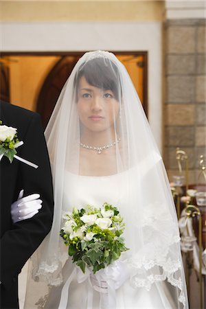 string of pearls for wedding - Bride Standing with Groom in Church Stock Photo - Rights-Managed, Code: 859-03039159