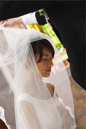 string of pearls for wedding - Groom Lifting Veil Stock Photo - Rights-Managed, Code: 859-03039174