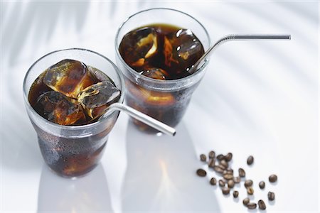 Glasses of black coffee with straws Stock Photo - Rights-Managed, Code: 859-03039334
