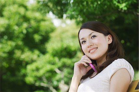 Young Woman Conversing on Mobile Phone Stock Photo - Rights-Managed, Code: 859-03039399