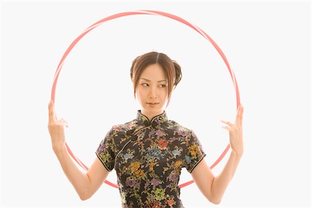Young Asian woman holding hoop Stock Photo - Rights-Managed, Code: 859-03039868