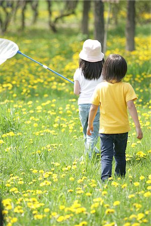 person walking field flowers - Two kids in field with bug hunting net Stock Photo - Rights-Managed, Code: 859-03039904