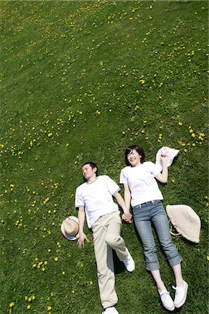 someone laying down aerial view - Young Asian couple lying on grass Stock Photo - Rights-Managed, Code: 859-03039907