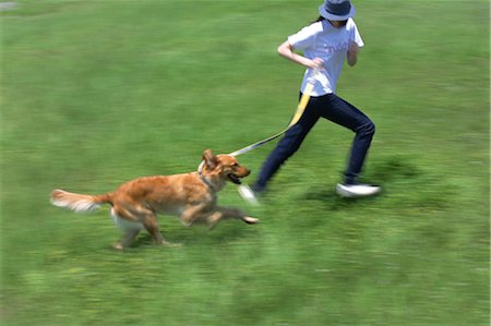 dog walk asian - Dog and Woman In Field Stock Photo - Rights-Managed, Code: 859-03041047
