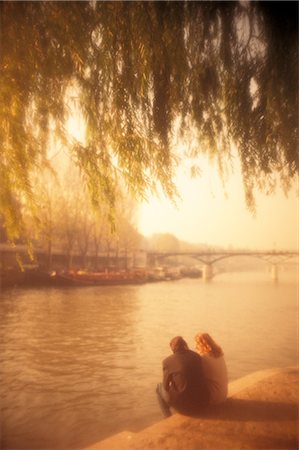 fall pictures of paris - Couple Sitting On River Bank Stock Photo - Rights-Managed, Code: 859-03041772