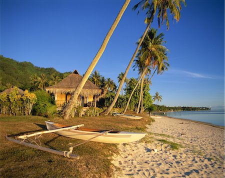 Beached fishing boats by lakehouse Stock Photo - Rights-Managed, Code: 859-03043415