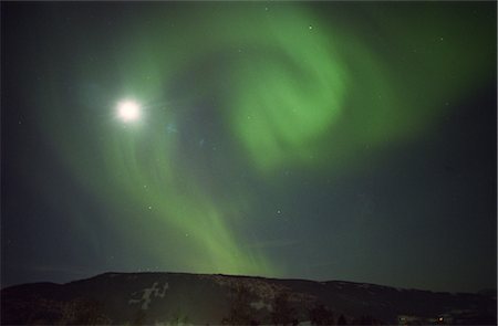 simsearch:859-03043645,k - Aurora Borealis over a Mountain Stock Photo - Rights-Managed, Code: 859-03043629