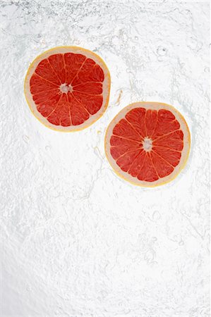 falling fruit white background - Grapefruits Splashing In To Water Stock Photo - Rights-Managed, Code: 859-03598665