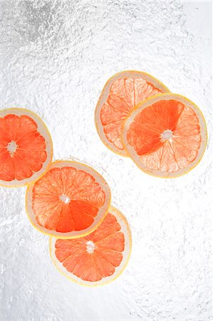 falling fruit white background - Grapefruits Splashing In To Water Stock Photo - Rights-Managed, Code: 859-03598667