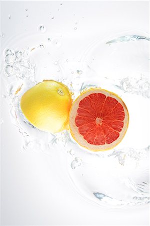 falling fruit white background - Grapefruits Splashing In To Water Stock Photo - Rights-Managed, Code: 859-03598663