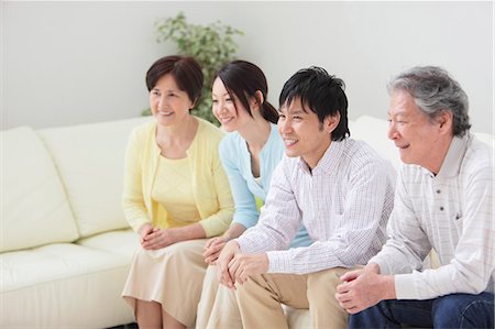 senior man watching tv family - Japanese Family Relaxing On Sofa Stock Photo - Rights-Managed, Code: 859-03598748