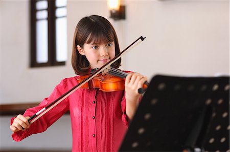 A Young Girl Playing The Violin Stock Photo - Rights-Managed, Code: 859-03598838