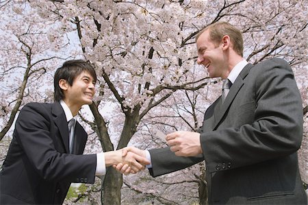 Businessmen Shaking Hands and Greeting Stock Photo - Rights-Managed, Code: 859-03598985