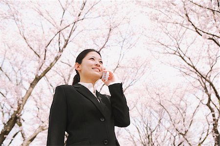 Businesswoman Interacting on Cell Phone Stock Photo - Rights-Managed, Code: 859-03599162